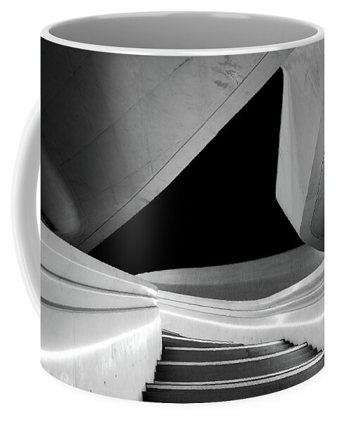 Futuristic Building Coffee Mug featuring the photograph Modern architecture and empty staircase leading to a bright open space. by Michalakis Ppalis