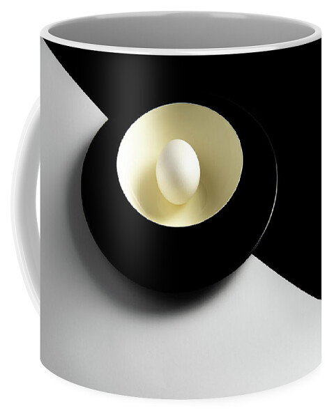 Still-life Coffee Mug featuring the photograph Single fresh white egg on a yellow bowl by Michalakis Ppalis