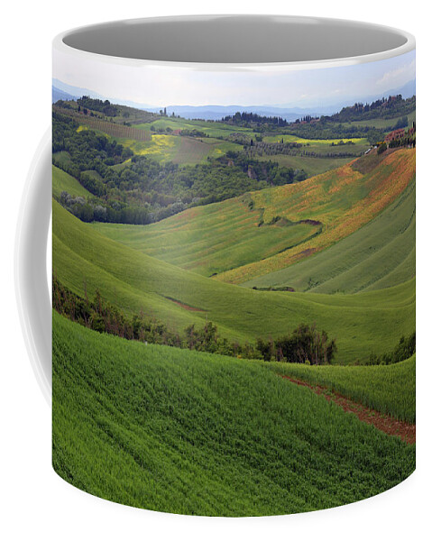 Field Coffee Mug featuring the photograph Tuscany farmland hill fields in Italy #1 by Mikhail Kokhanchikov