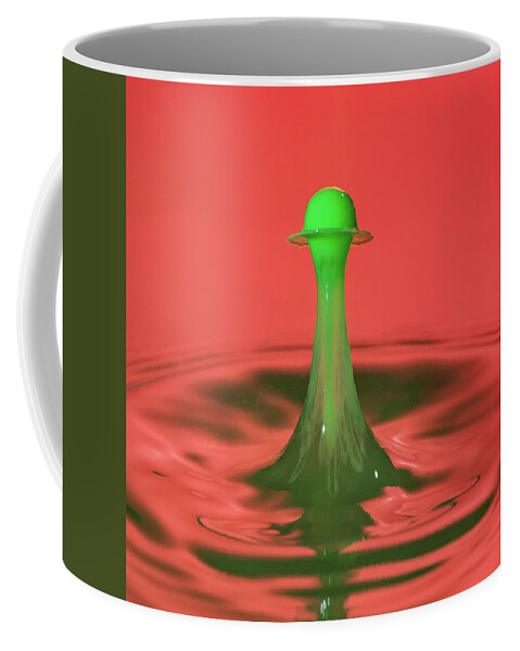 Waterdrop Coffee Mug featuring the photograph Water drop falling onto column of water by Steven Heap