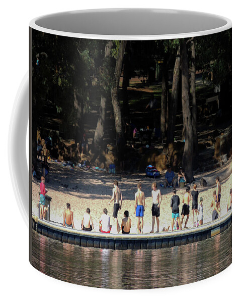  Coffee Mug featuring the photograph A line of sun lovers on the banks of Lake Leschenaultia, Western by Jeremy Holton