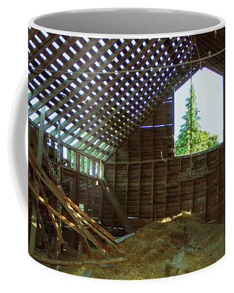 Barn Coffee Mug featuring the photograph A majestic evergreen through the eyes of an old barn by Leslie Struxness