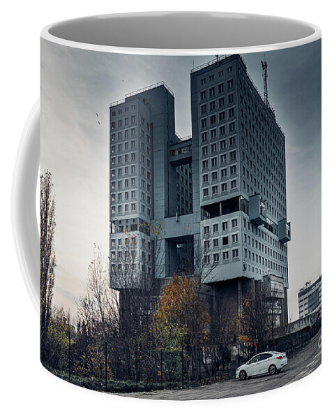 City Coffee Mug featuring the photograph Abandoned building in centre of city by Marina Usmanskaya