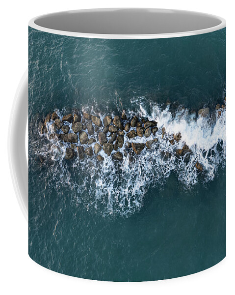 Ocean Coffee Mug featuring the photograph Aerial view from a flying drone of blue sea water and break water. Sea wall coastline by Michalakis Ppalis