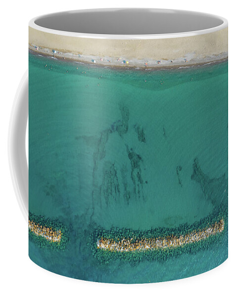 Beachfront Coffee Mug featuring the photograph Aerial view from flying drone of people relaxing on the beach. Paphos Cyprus by Michalakis Ppalis