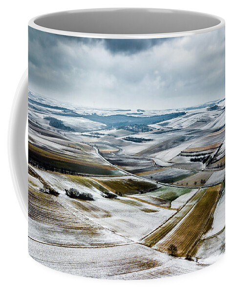 Above Coffee Mug featuring the photograph Aerial View Of Winter Landscape With Remote Settlements And Snow Covered Fields In Austria by Andreas Berthold
