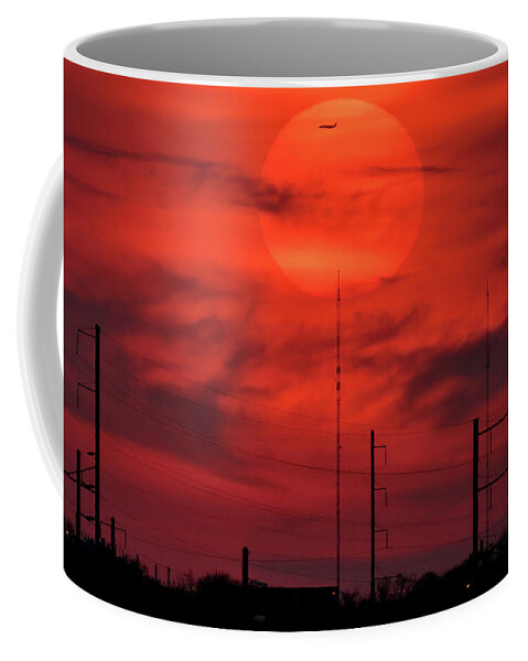 Sunset Coffee Mug featuring the photograph Airplane Passing in Front of Setting Sun Over Philadelphia by Linda Stern