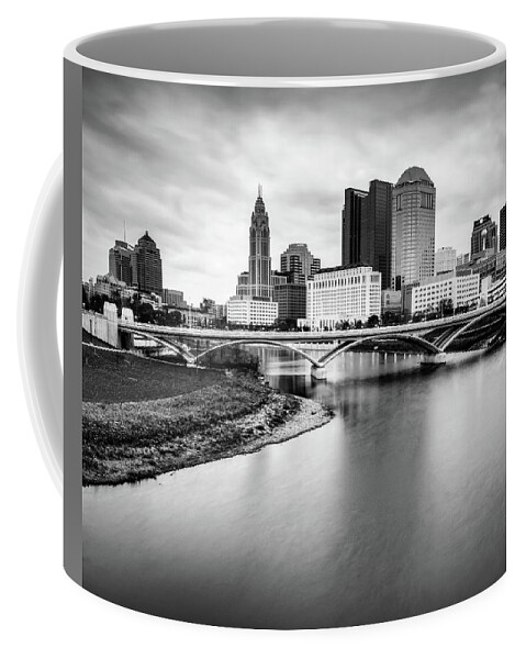 Columbus Skyline Coffee Mug featuring the photograph Architectural Skyline of Columbus Ohio and Scioto River - Black and White Edition by Gregory Ballos