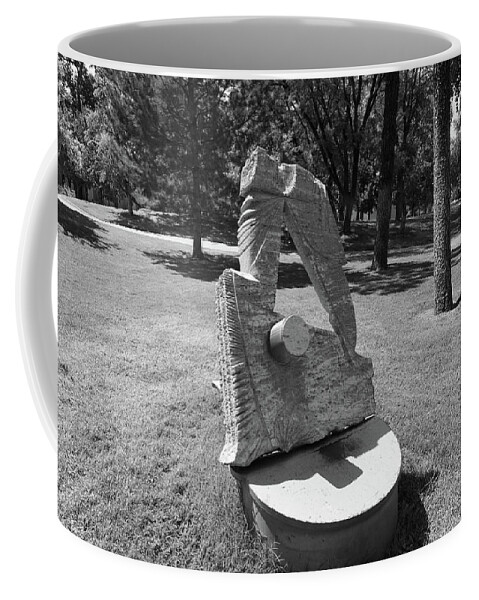 Albuquerque Coffee Mug featuring the photograph Art statue on the campus of the University of New Mexico in black and white by Eldon McGraw