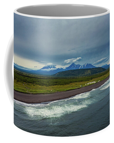 Beach Coffee Mug featuring the photograph Beach with black sand and volcano by Mikhail Kokhanchikov