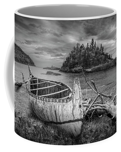 Art Coffee Mug featuring the photograph Birch Bark Canoe ashore on Driftwood Beach in Black and White by Randall Nyhof