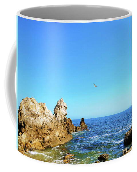 Ocean Coffee Mug featuring the photograph Bird in the Sky at the Beach by Marcus Jones