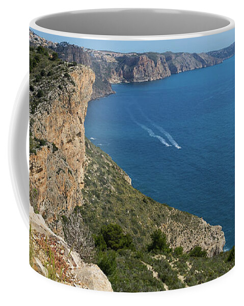 Mediterranean Sea Coffee Mug featuring the photograph Blue Mediterranean Sea and limestone cliffs by Adriana Mueller
