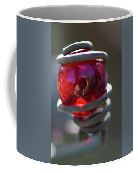 Red Coffee Mug featuring the photograph Bright Red Glass Marble Light Catcher Art by Kathy Clark