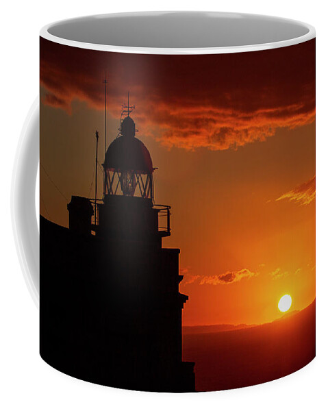 Night Coffee Mug featuring the photograph Cape Prior Silhouetted Lighthouse against Orange Sky Sunset and Sun at the Horizon Ferrol La Corua Galicia by Pablo Avanzini