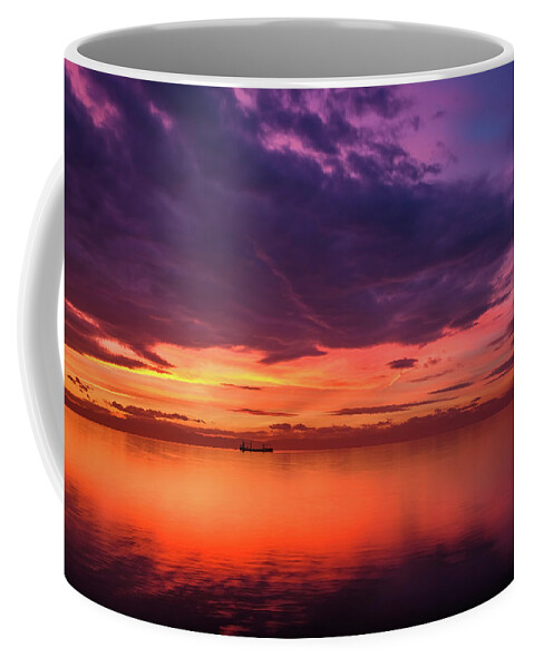 Sea Coffee Mug featuring the photograph Cargo Ship Silhouette in a Dramatic and Colorful Sunset by Alexios Ntounas