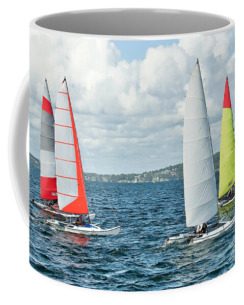 Csne62 Coffee Mug featuring the photograph Children Sailing small catamiran sailboats with colourul sails. by Geoff Childs