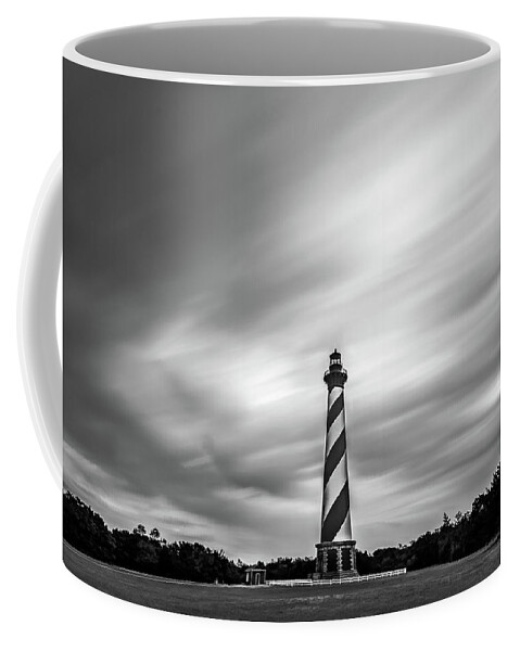 North Carolina Coffee Mug featuring the photograph Clouds and lighthouse at Outer Banks, North Carolina by Robert Miller