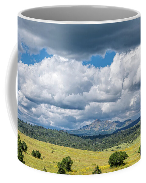 Chama Coffee Mug featuring the photograph Clouds Build Over Landscape of Chama New Mexico by Debra Martz