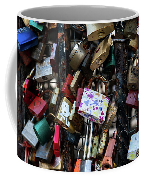 Attached Coffee Mug featuring the photograph Colorful Love Padlocks Attached On Iron Fence by Andreas Berthold