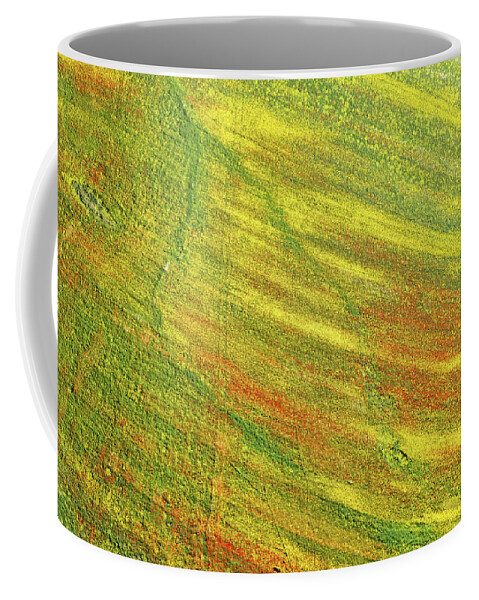 Springtime Coffee Mug featuring the photograph Drone aerial field with yellow blooming and red flowers. Spring landscape background by Michalakis Ppalis