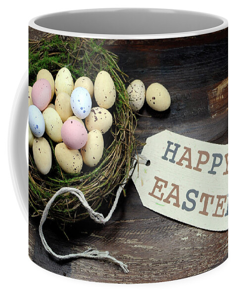 Easter Coffee Mug featuring the photograph Easter candy easter eggs in birds nest by Milleflore Images