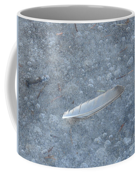 Feather Coffee Mug featuring the photograph Feather on Ice by Nicola Finch