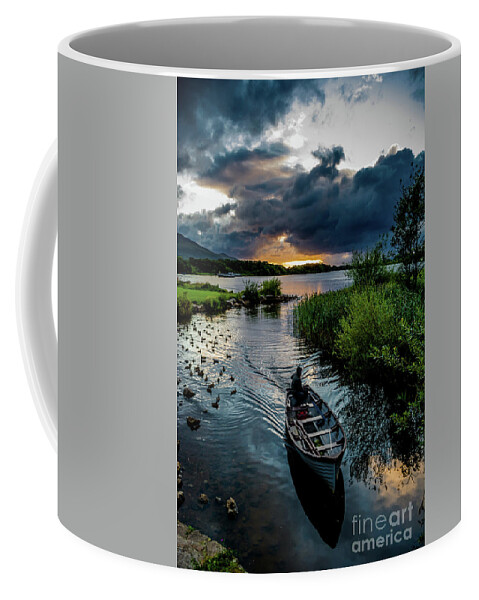 Ireland Coffee Mug featuring the photograph Fisher boat returns at sunset from Lough Leane in Killarney National Park in Ireland by Andreas Berthold