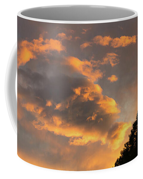 Clouds Coffee Mug featuring the photograph Glowing sky by Adriana Mueller