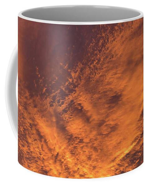 Clouds Coffee Mug featuring the photograph Glowing sunset sky with deep orange clouds by Adriana Mueller