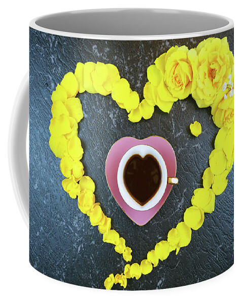 Yellow Coffee Mug featuring the photograph Good morning concept with coffee cup in heart shaped fresh yellow roses. by Milleflore Images