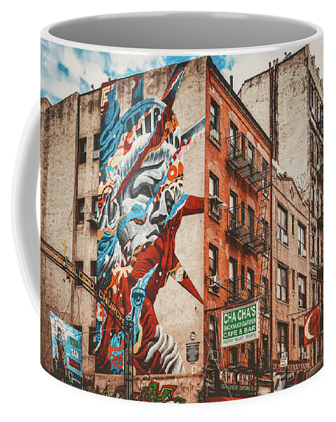 New York Coffee Mug featuring the photograph Graffiti of the Statue of Liberty in New York's Little Italy by Karel Miragaya