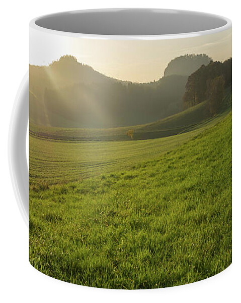 Saxon Switzerland Coffee Mug featuring the photograph Green meadow and golden light 1 by Adriana Mueller