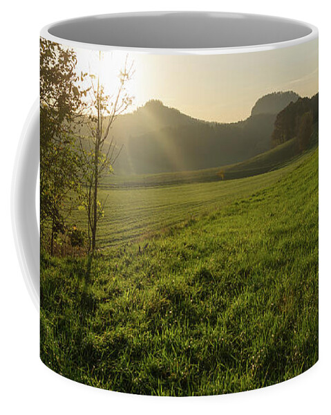 Saxon Switzerland Coffee Mug featuring the photograph Green meadow and golden light 3 by Adriana Mueller