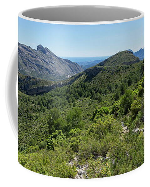 Mountain Coffee Mug featuring the photograph Green mountain landscape and the rock Cavall Verd by Adriana Mueller