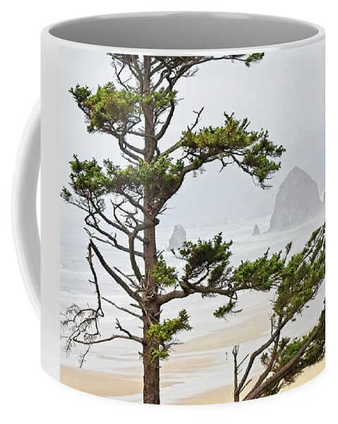 West Coffee Mug featuring the photograph Haystack Rock on Cannon Beach by Loren Gilbert