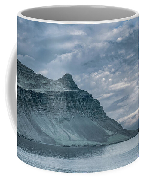  Coffee Mug featuring the photograph High and Lofty Along the Coast of Iceland by Marcy Wielfaert