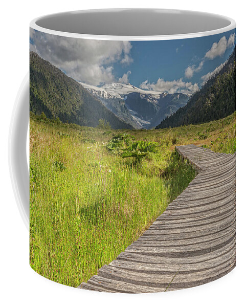 Chile Coffee Mug featuring the photograph Hiking path to the Michinmahuida glacier by Henri Leduc
