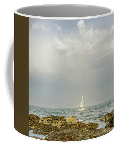 England Coffee Mug featuring the photograph Lone Sailor at Penmon Point by Spikey Mouse Photography