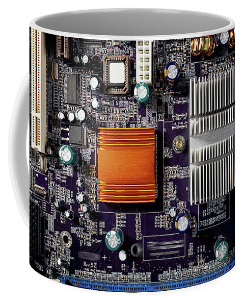 Computer Coffee Mug featuring the photograph Mainboard of a pc with electronic components. by Bernhard Schaffer