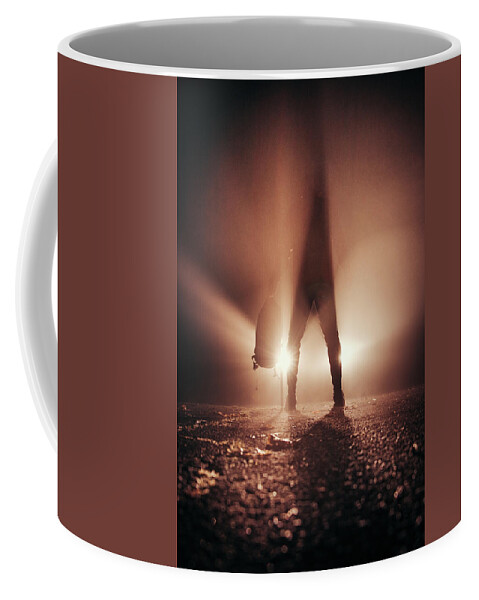 Figure Coffee Mug featuring the photograph Man stands in car lights by Vaclav Sonnek