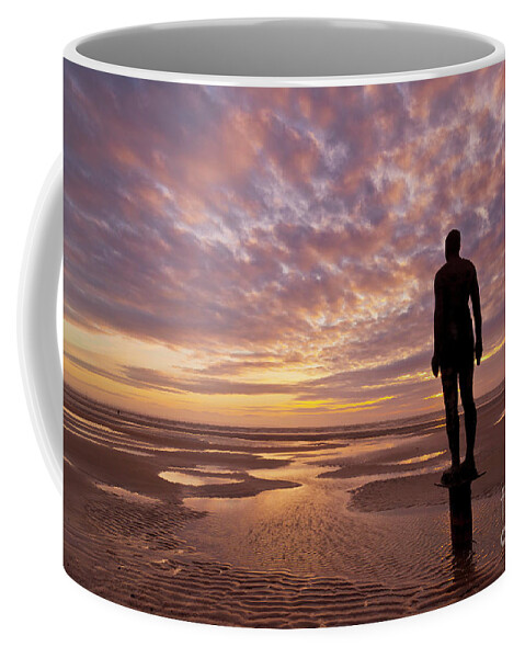 Another Place Coffee Mug featuring the photograph Metal statues on Crosby beach, Merseyside, England by Neale And Judith Clark
