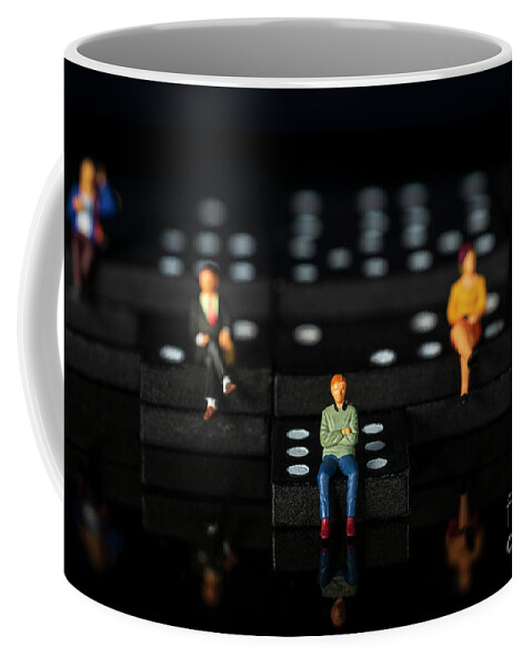Conceptual Coffee Mug featuring the photograph miniature people on dominoes Black background Macro by Pablo Avanzini