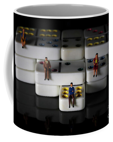 Conceptual Coffee Mug featuring the photograph miniature people on white colored dominoes Black background macro by Pablo Avanzini