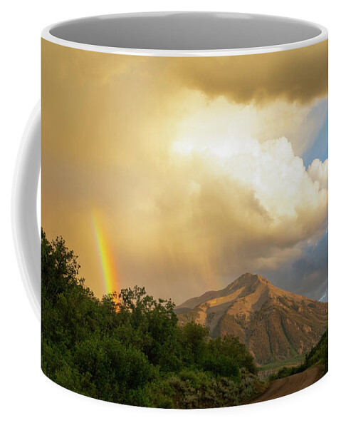 Mountain Coffee Mug featuring the photograph Mountain Rainbow by Don Schwartz