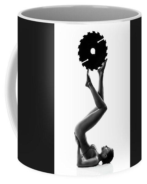 Woman Coffee Mug featuring the photograph Nude woman with saw blade 2 by Johan Swanepoel