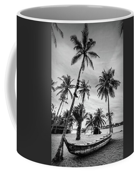 Black Coffee Mug featuring the photograph Old Canoe Under the Palms Black and White by Debra and Dave Vanderlaan