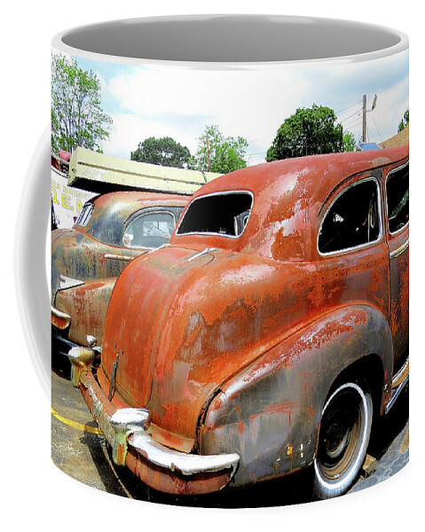 Cadillac Coffee Mug featuring the photograph Pair of Rusty 1947 Cadillac Imperial Limos by Linda Stern