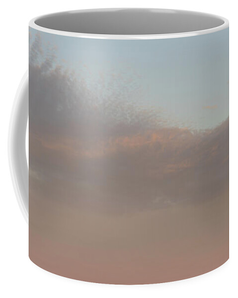 Mediterranean Coast Coffee Mug featuring the photograph Pale pink sky and soft clouds at sunset on the Mediterranean coast by Adriana Mueller