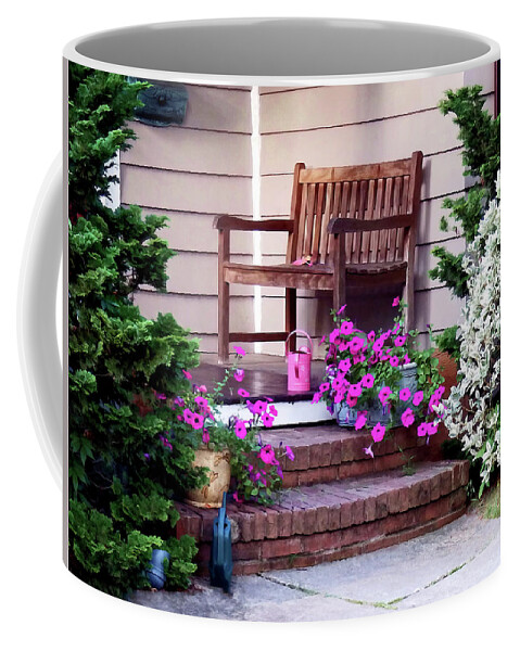 Petunia Coffee Mug featuring the photograph Pink Petunias and Watering Cans by Susan Savad